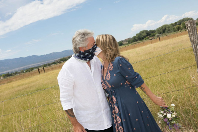JR and Susan kissing during their pandemic wedding