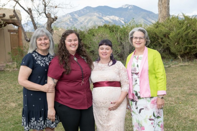 Two brides and their two mothers who came to this destination wedding