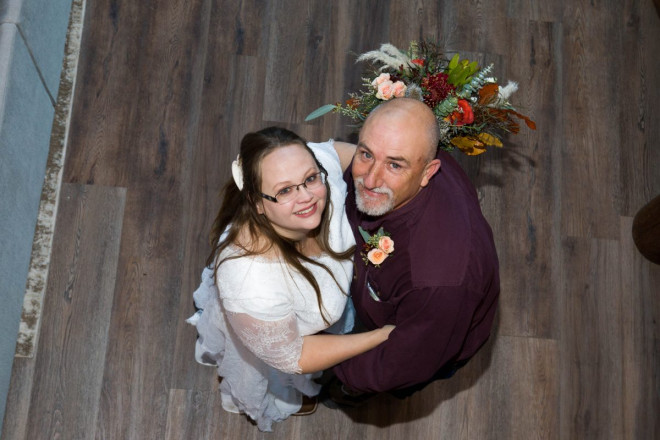 Celeste and Joe smile from downstairs at Almost Heaven in Red River