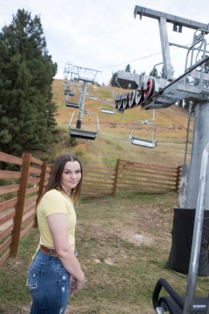 Katie with the ski lift before the next big snow in Red River, NM