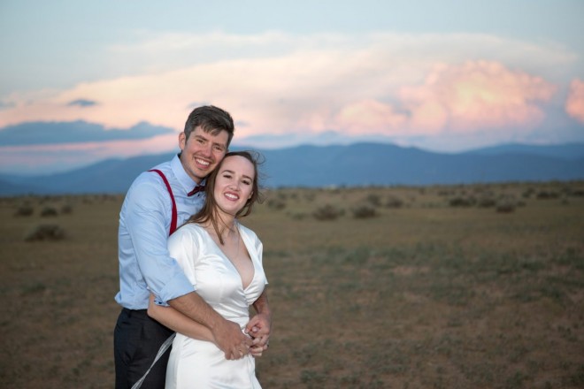 Pink Clouds adorning Taos mountains at your wedding elopement is definitely good luck!