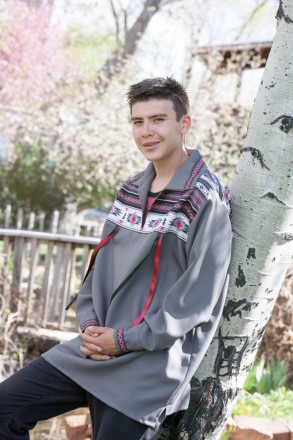 Senior in Taos wears a ribbon shirt for his senior photos