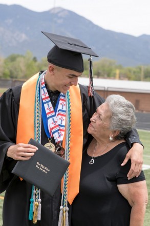 Taos graduate with his grandma on graduation day at Taos High School