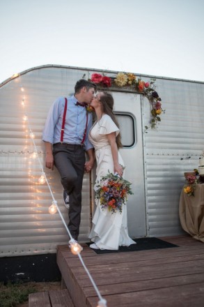 Kiss outside of trailer on wedding night at Hotel Luna Mystica