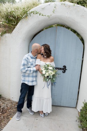 Seth's light blue was perfect by this adobe arch and wooden doors which are typical southwest architecture.