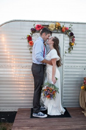 Romantic photo with trailer porch décor and wedding bouquet