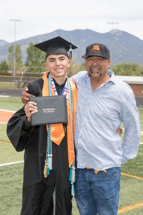 Taos High School graduate on graduation day with Uncle