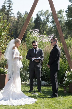 Courtney looked like a princess in her long sleeve wedding dress and layered veil