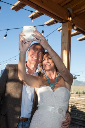 Bill and Chasity take a selfie on their Instax reception camera
