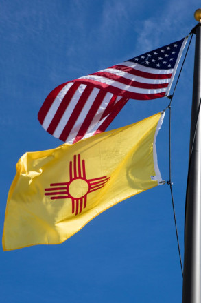 American flag and New Mexico Zia flag flying outside Eagle Nest Lake visitor center