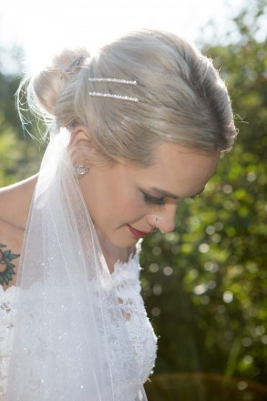 The sunshine on Courtney at golden hour was playful with her jewelry and wedding veil