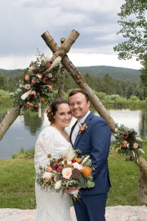 Scarlet and Clynt smile after their slightly rainy wedding ceremony in Taos Canyon