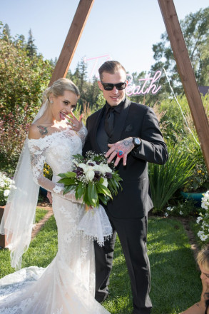 Travis, in sunglasses, shows off his "rock" -- a candy ring exchanged during the wedding ceremony