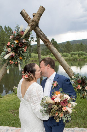 Scarlet and Clynt start laughing during this kiss at their altar