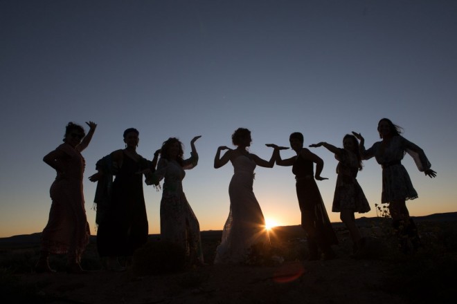Taos bridesmaids having fun at a September sunset on the mesa