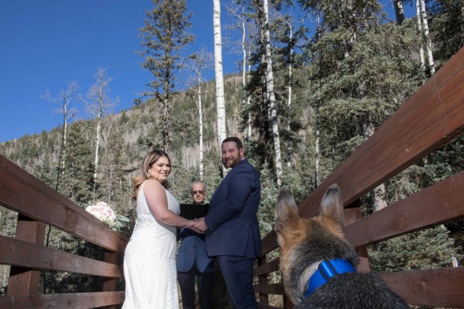 Dan Jones recites unique wedding ceremony while best-dog looks on.