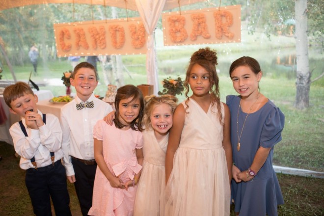 The children at this Taos mountain wedding flock to the candy bar