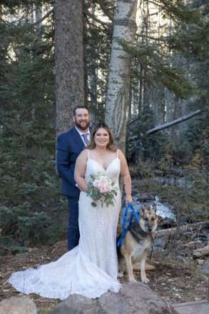 Bride and groom with their German Shepard in the Taos Ski Valley