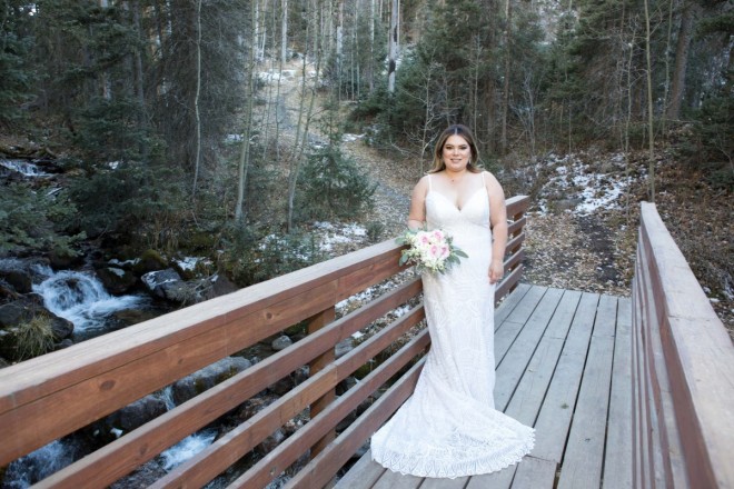Taos Ski Valley bride with bouquet with garden roses, touches of snow in background