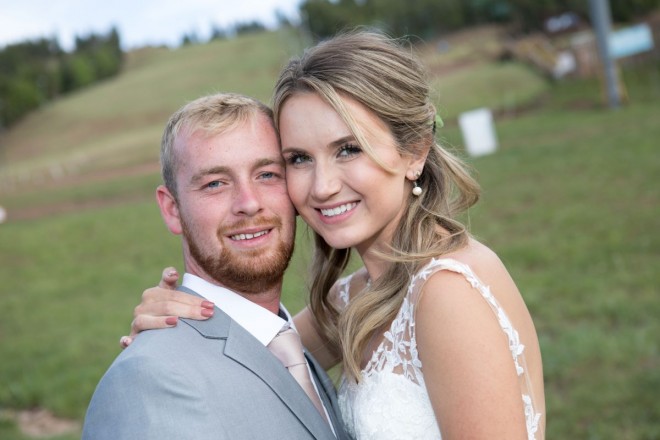 Jade and Brannon smile for the camera after their Angel Fire resort wedding ceremony