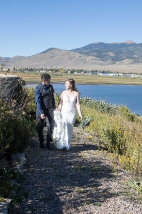 Israel and Victoria take a walk on the path around Eagle Nest Lake after their wedding