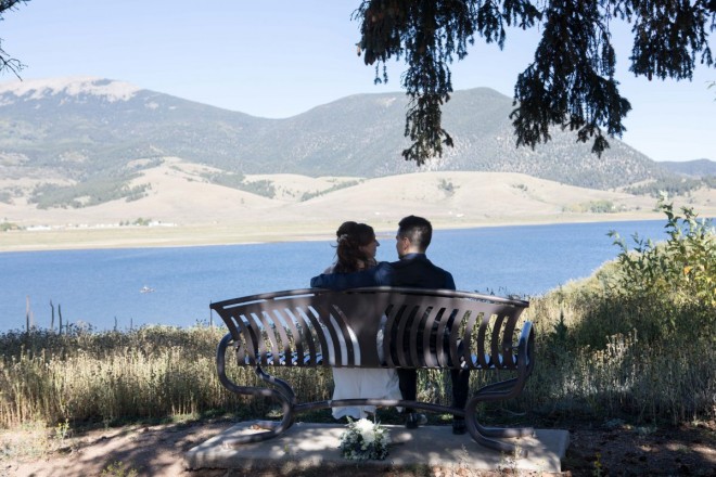 The bride and groom sit in the quiet by the Eagle Nest visitor center