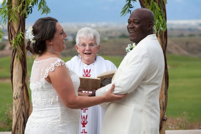 A wedding laugh at the Taos Country Club during an outdoor wedding ceremony