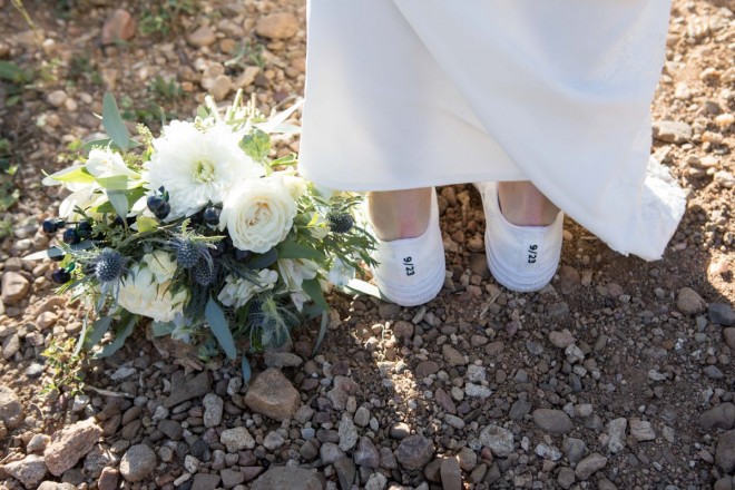 Wedding bouquet and converse sneakers featuring the wedding date