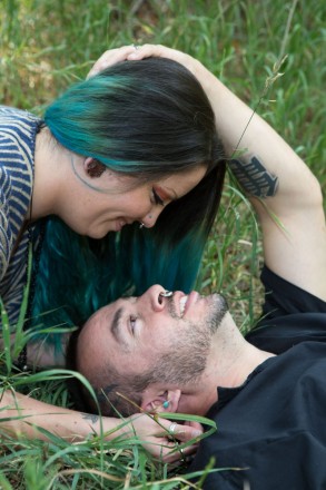 Young tattooed couple enjoys their engagement session