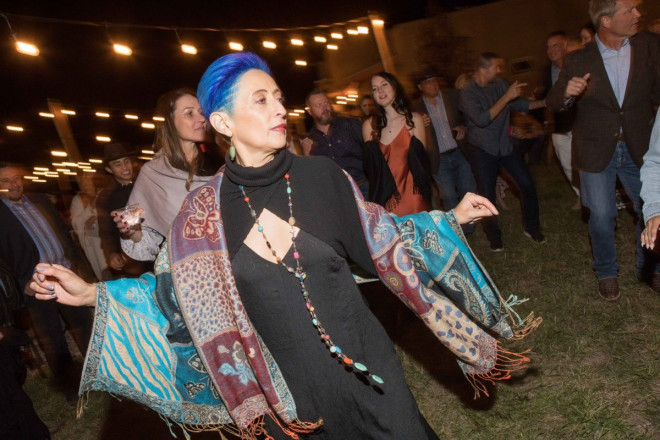 Texan wedding guests grabbed a 2nd layer and kept dancing at the outdoor Taos wedding