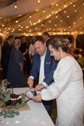 Cake cutting at Taos canyon wedding in a tent