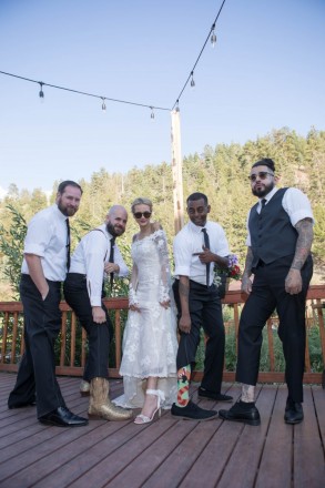 Groomsmen show off their shoes and socks