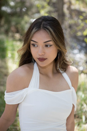 Penasco senior, Jenica, poses next to creek in Taos Canyon