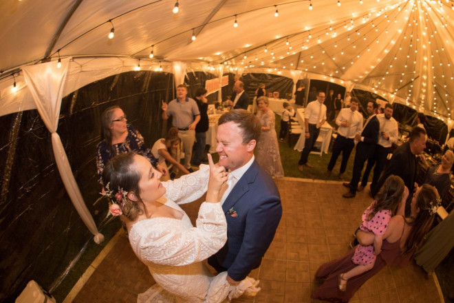 Scarlet and Craig share a moment during a dance together at their summertime wedding reception