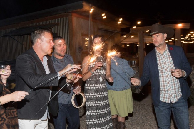 Taos wedding guests lighting sparklers to send off the bride and groom
