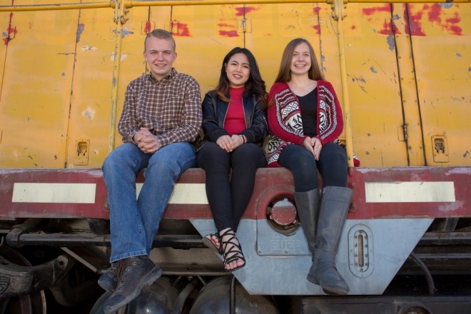 Colorful portrait of three siblings at Santa Fe railyard