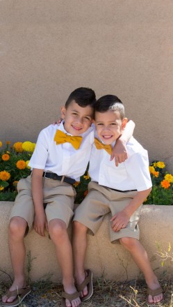 Brothers in matching outfits smile for family pictures